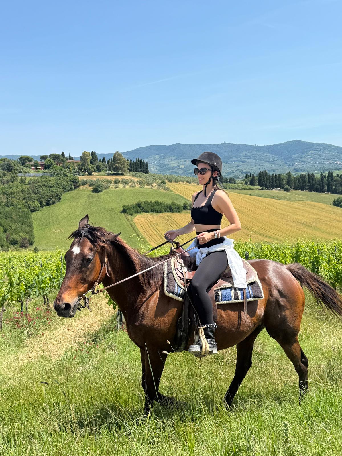 Horseback riding through Tuscany vineyards